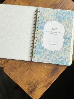 If you love having your life organized, you NEED this 2027 planner! 🤍📖✨ It has monthly + weekly planning pages so you can see the big picture AND keep up with all the little details. Perfect for appointments, goals, Bible study, family schedules, and everything in between! ✨ New year, fresh pages, fresh start! #2027planner #planneraddict #organizedhome #monthlycalendar #weeklyplanner 