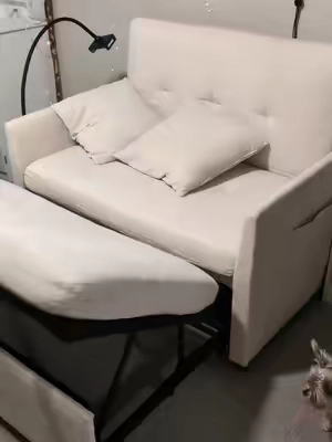 Loveseat sleeper sofa with a USB port, an arm for your phone or tablet and it has pockets for books or remotes. #sleepersofa #functionalfurniture #loveseat #sleepover 