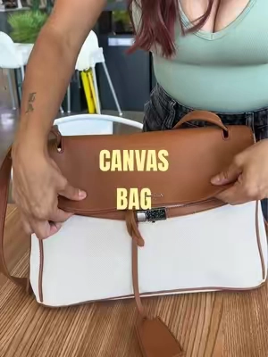 The cream + cognac combo?! 🤌🏼🤎 She looks so luxe, holds ALL the things, and instantly makes an outfit look more put together. This is definitely an everyday bag that doesn’t look like an everyday bag. #backtoschool #TikTokshopbacktoschool #laptopbag #workbag #canvasbag 