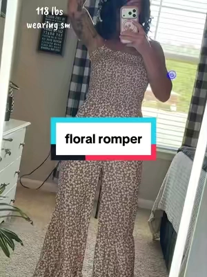 One-and-done outfits are undefeated. 🤎 This floral jumpsuit has a smocked bodice, thin straps + flowy wide legs that give it that easy boho look without having to style a whole outfit. #rompers #floralromper #jumpsuitoutfit #jumpsuits #tiktokbacktoschool 