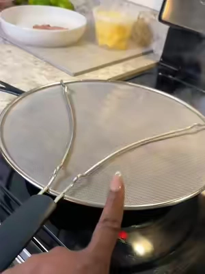 Protects ME from all of that grease popping on me too!! Where has this been all my life??!  #kitchenfinds #CookingHacks #kitchenessentials #cookingtips 