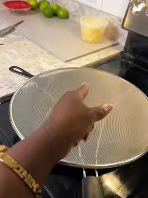 Splatter guard keeps oil from burning me & saves me clean up while cooking.  #CookingHacks #cookingtips #kitchenessentials #kitchenfinds 