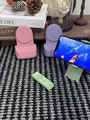 botanytime234 • Creator Sit back, relax, and browse TikTok without lifting a finger. This remote creates the ultimate effortless scrolling experience. #phonestandholder #phoneaccesories #tiktokshop #bedrotting #summerwins
